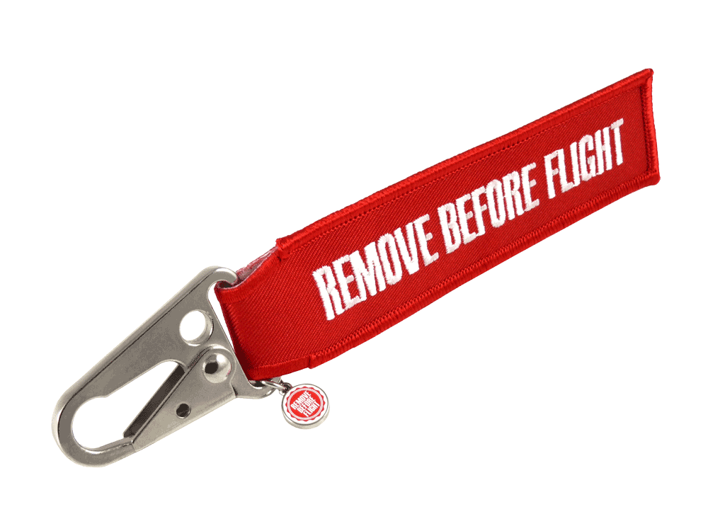 Remove Before Flight Anhänger mit Karabiner – Rot Roter Remove Before Flight Textil-Anhänger mit Metallkarabiner